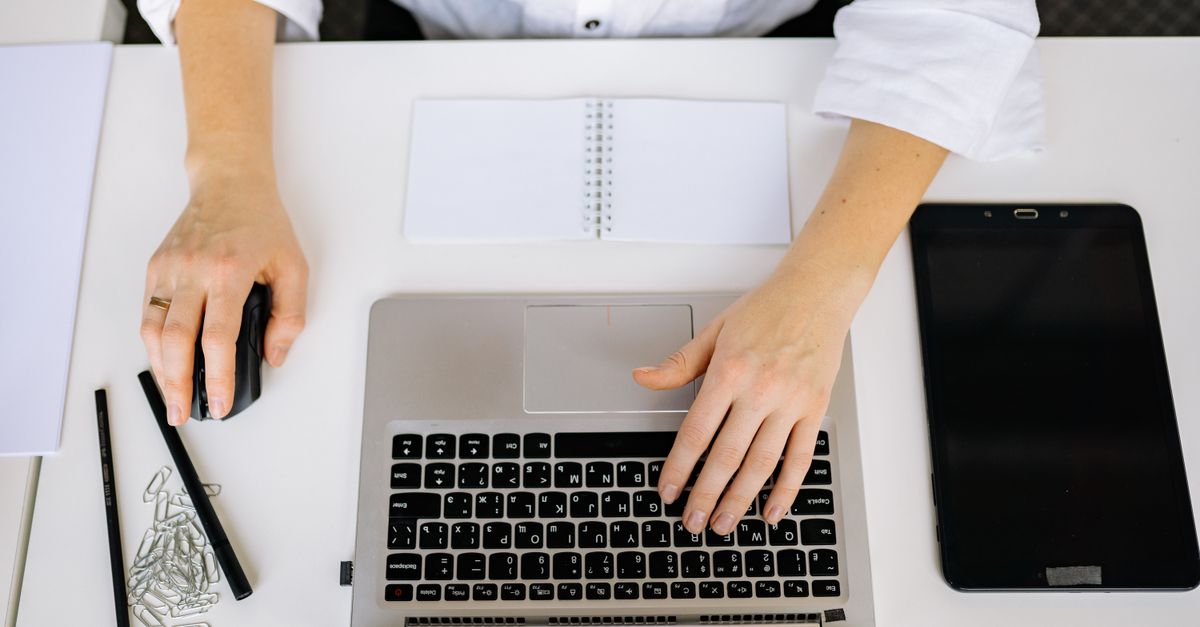 A compliance team working through third party penetration testing requirements documents at a desk