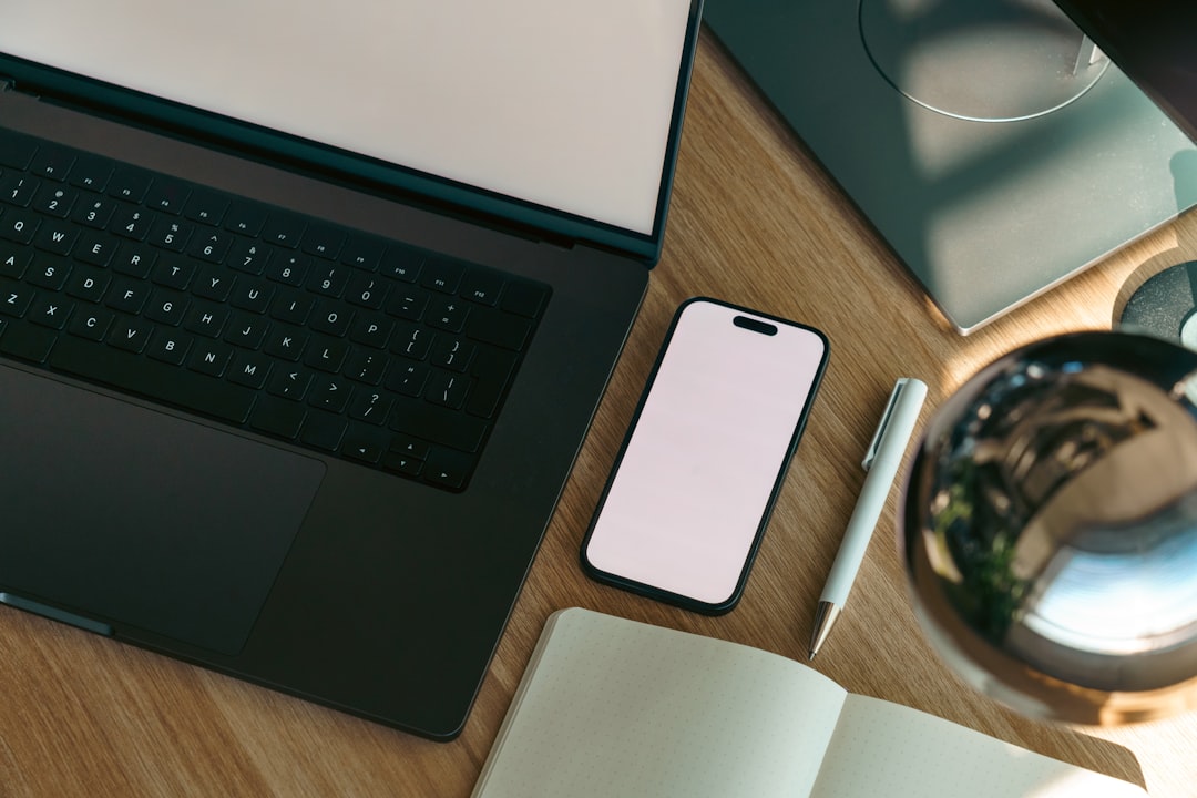A laptop, phone and open notebook on a desk, ready for an AI agent cyberattack security checklist
