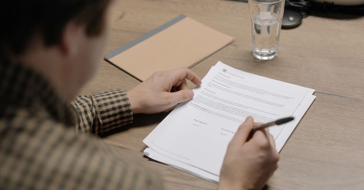 A person signing a written testing authorisation document, the scoping paperwork that starts a penetration test