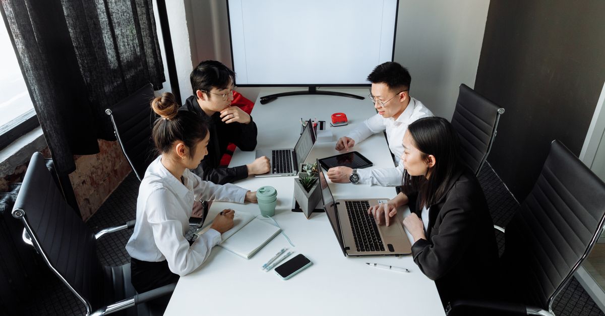 A security team discussing penetration testing remediation findings around a table