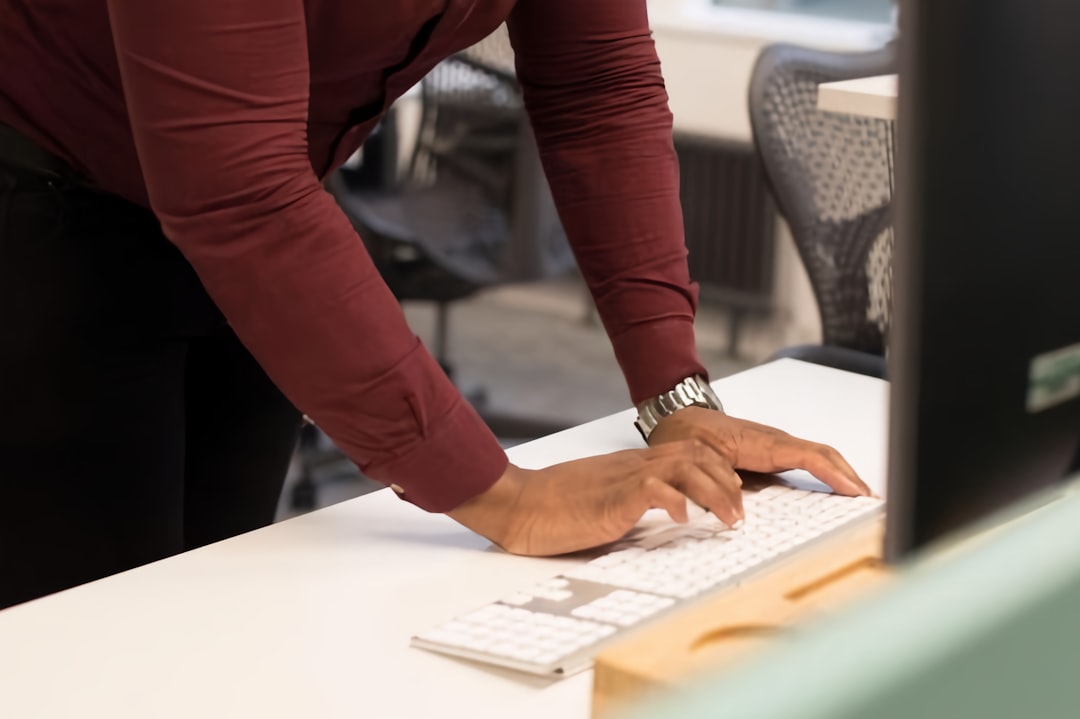 Close-up of hands patching a server over a keyboard after a critical nginx vulnerability disclosure