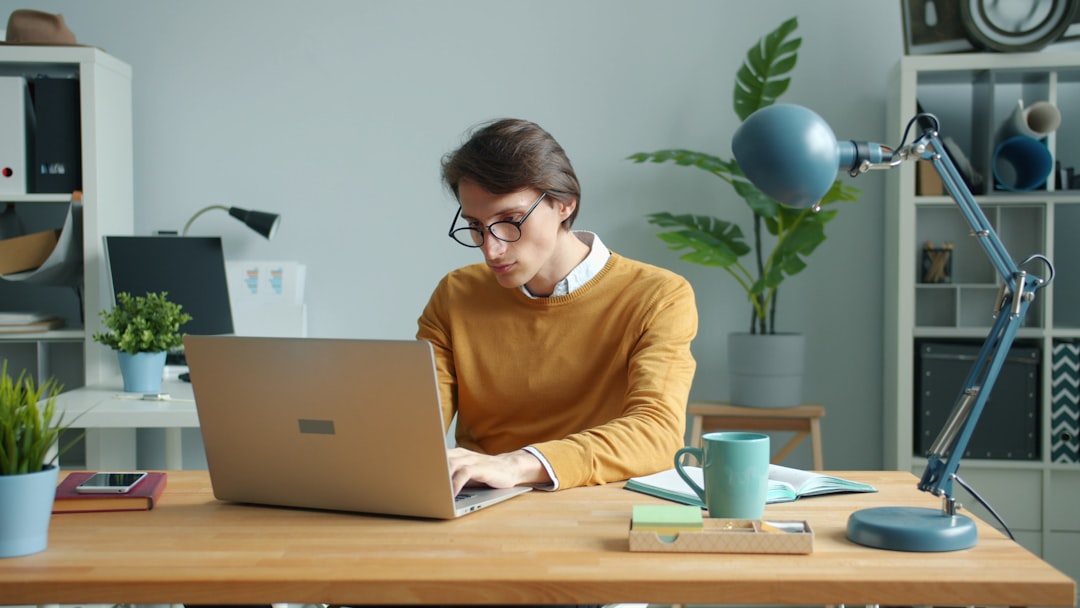 An analyst working through validation testing on a laptop for a continuous threat exposure management cycle