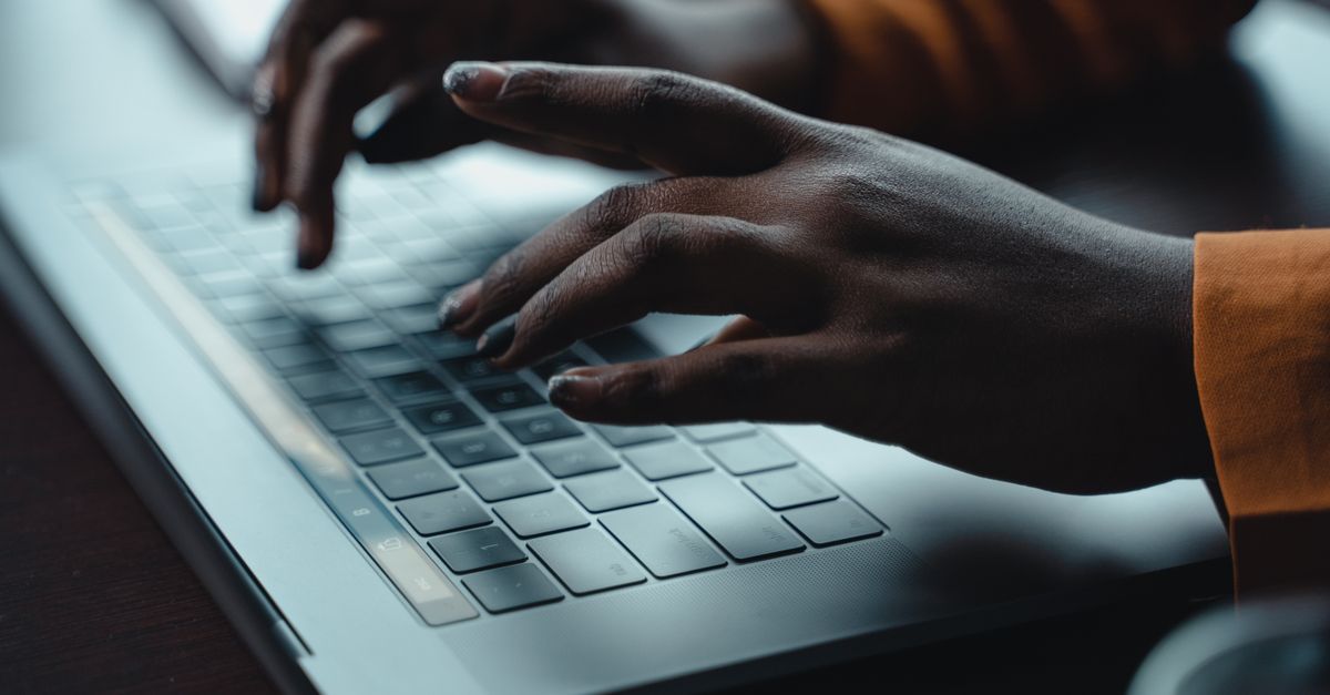 Close-up of hands patching a server after a TeamCity remote code execution warning