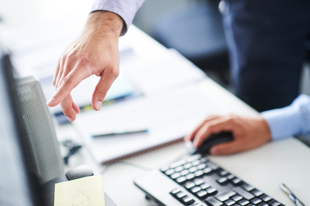 Hands typing on an office keyboard, representing the WordPress admin check needed after the Forminator plugin vulnerability disclosure