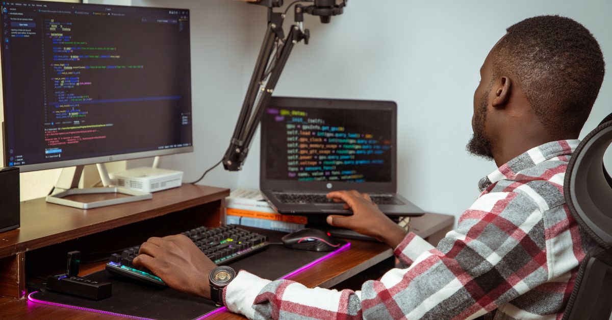 Security tester working at a multi-monitor setup during a penetration test