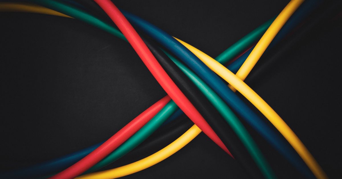 Coloured network cables crossing, representing the router and network infrastructure at risk from the MikroTik router compromised campaign