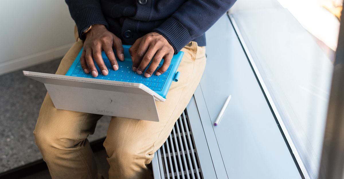 IT professional patching a laptop after the Switchvox vulnerability disclosure