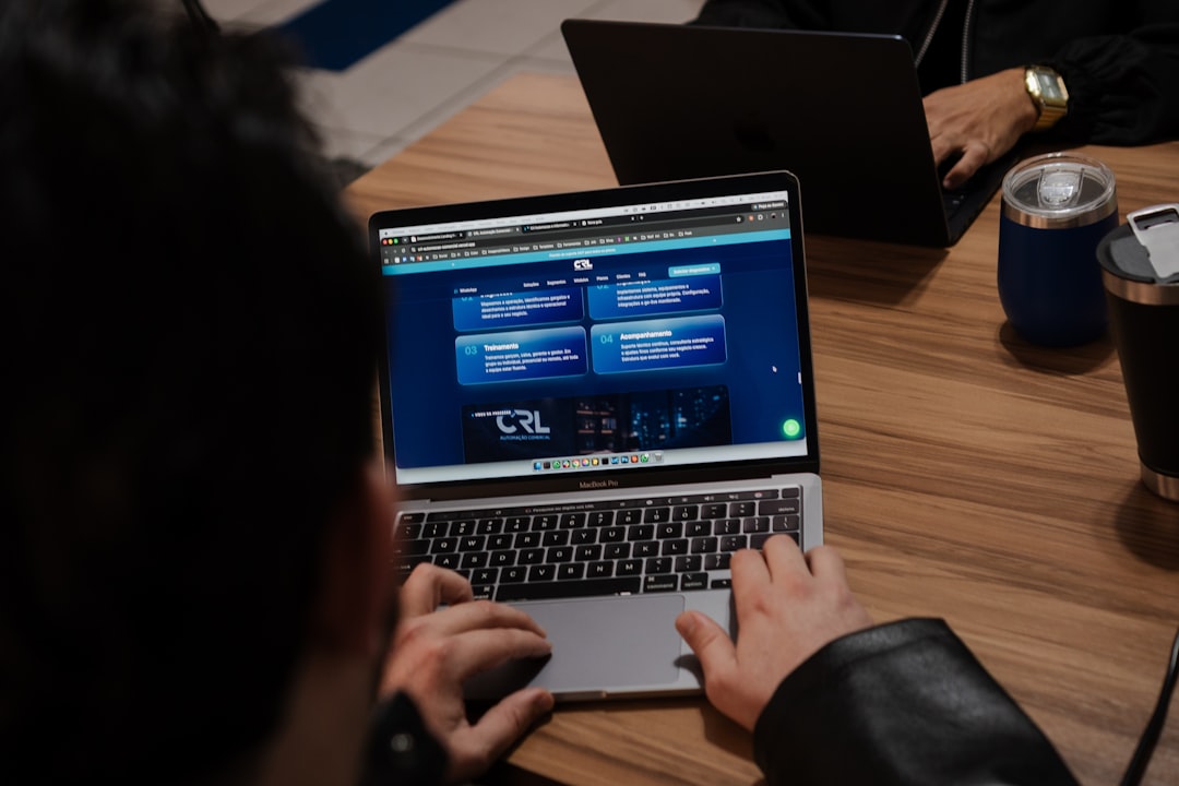 Person reviewing a live website on a laptop after a web application firewall alert