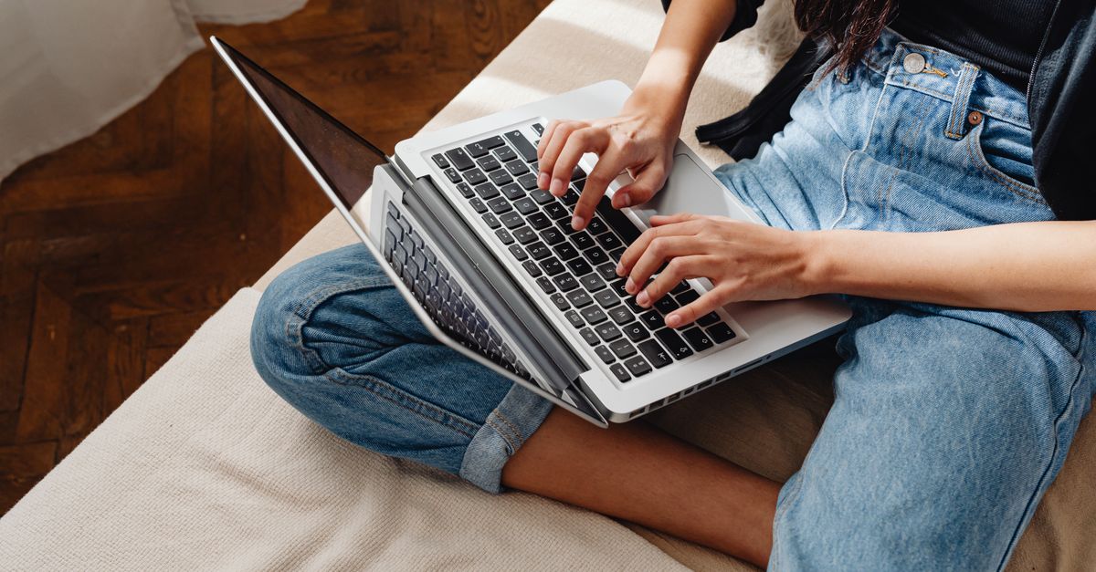 Remote worker typing on a laptop at home, the kind of remote access session a NetScaler Gateway secures