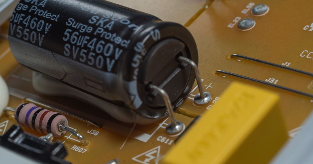 Capacitor and resistor on a circuit board inside an electronic device, relevant to hardware wallet implant checks