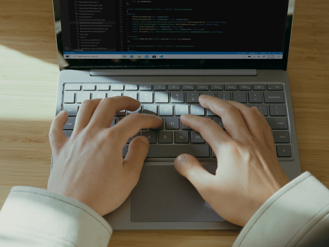 Hands typing on a laptop to sign in, as zero trust security checks every request