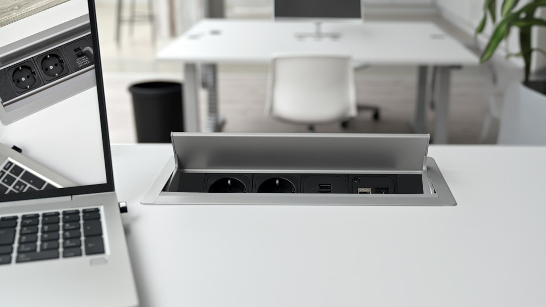 Office desk with a built-in network port, where a man in the middle attack could start on a local network