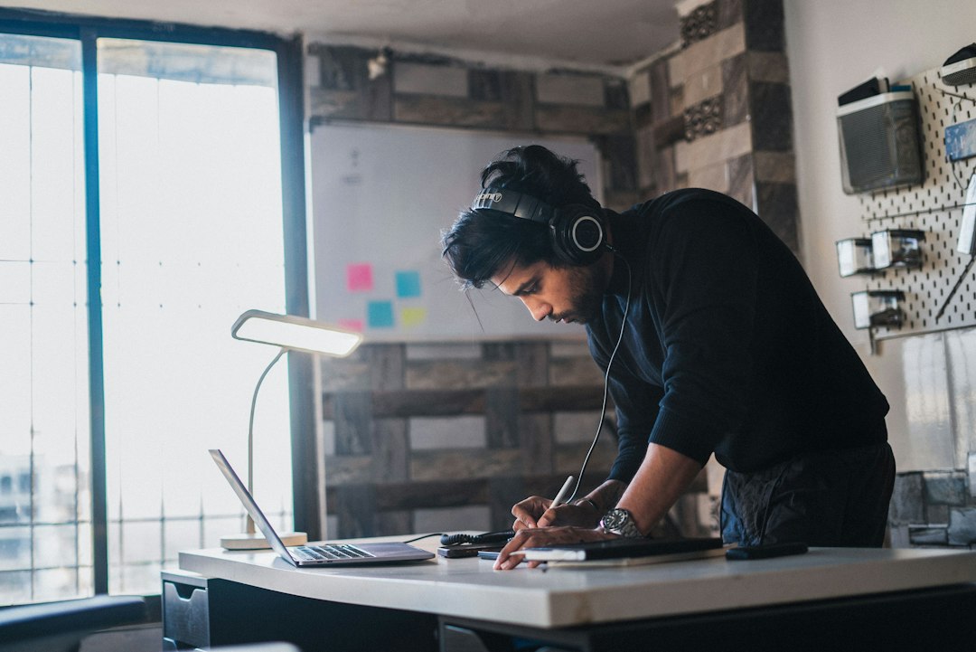Person signing off documents at a desk while preparing a penetration test certificate for a customer