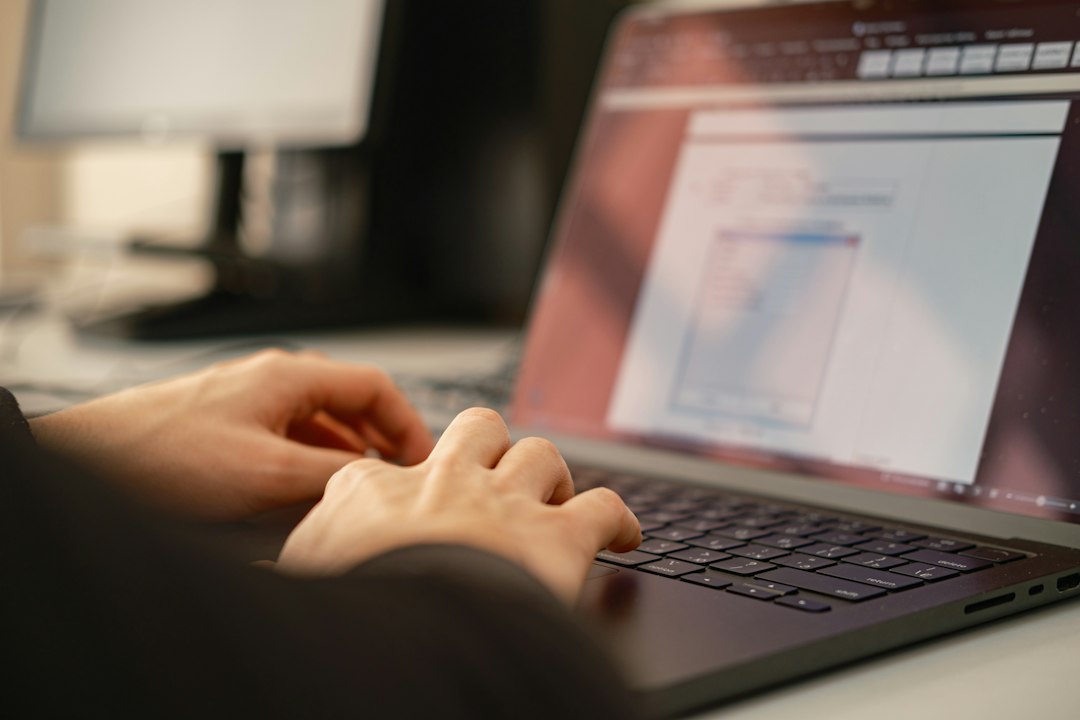 Person typing on a laptop, trusting the padlock after the ccTLD registry hijack