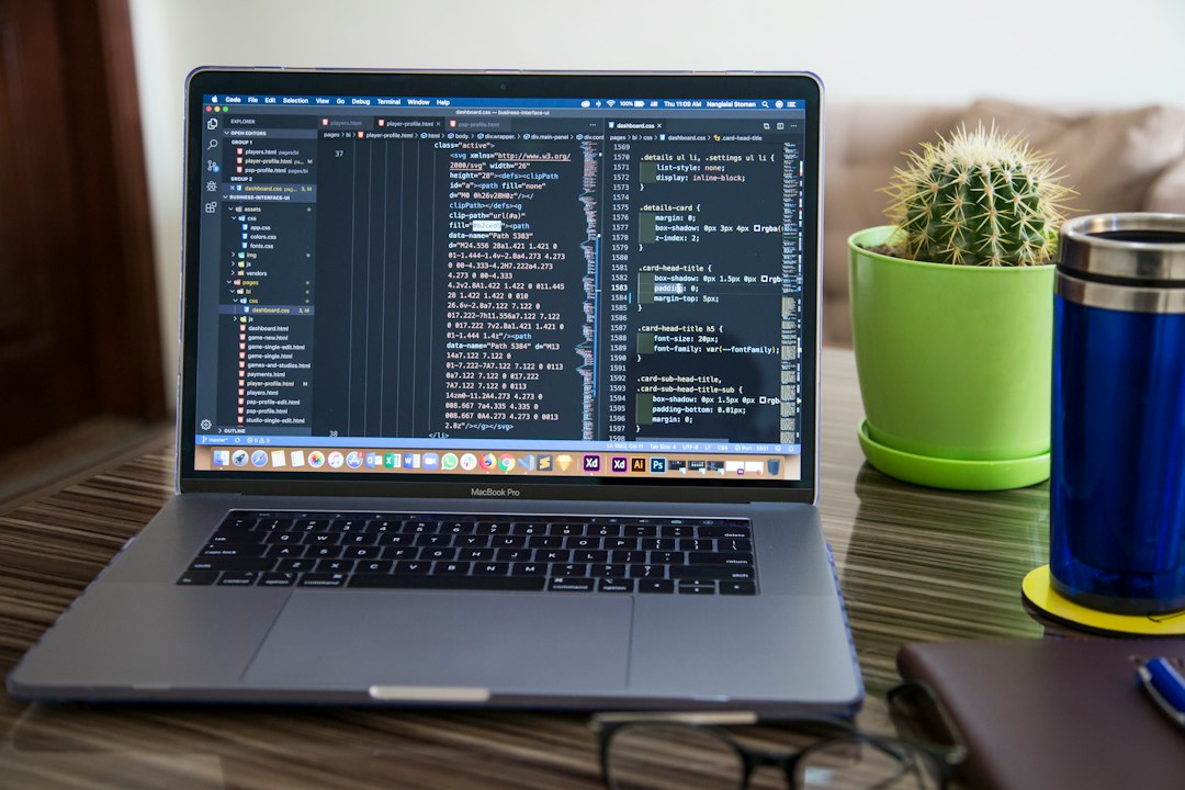 Web page source code open on a laptop, where cross site scripting flaws hide